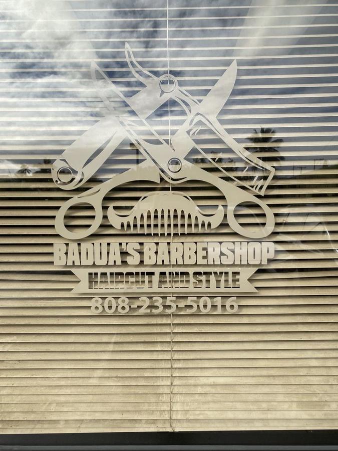 Badua's Barbershop window sign